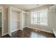 Walk-in closet with shelving, hanging rods, and window with natural light at 875 Soaring Cir, Marietta, GA 30062
