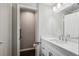 Bright bathroom featuring white vanity with modern fixtures and a separate toilet area at 1696 Thomas St, Decatur, GA 30032