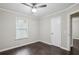 Bedroom featuring dark wood flooring, neutral walls, ceiling fan, and window with blinds at 1696 Thomas St, Decatur, GA 30032