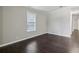 Bright bedroom with modern, dark floors and ample natural light at 1696 Thomas St, Decatur, GA 30032