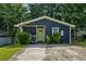Charming, renovated home with a vibrant yellow door and well-maintained front yard at 1696 Thomas St, Decatur, GA 30032