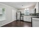 Modern kitchen with stainless steel appliances and white cabinets at 1696 Thomas St, Decatur, GA 30032