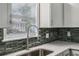 Close-up of modern kitchen sink with stylish faucet and backsplash at 1696 Thomas St, Decatur, GA 30032