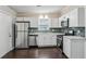 Updated kitchen with stainless appliances and modern cabinets at 1696 Thomas St, Decatur, GA 30032