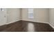 Freshly painted living room with dark wood floors and natural light at 1696 Thomas St, Decatur, GA 30032