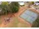 A community playground and tennis courts are shown in this aerial view at 245 Weatherstone Pointe Dr, Woodstock, GA 30188