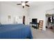 Spacious bedroom featuring a comfortable bed, walk-in closet, and a TV on a table, providing ample space at 245 Weatherstone Pointe Dr, Woodstock, GA 30188