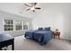 Bright bedroom with large windows offering natural light, complemented by a comfortable bed and neutral decor at 245 Weatherstone Pointe Dr, Woodstock, GA 30188