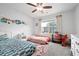 Bright bedroom with two beds, a window, and decorative elements, perfect for a room at 245 Weatherstone Pointe Dr, Woodstock, GA 30188