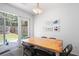 Sun-filled dining room with yard access and charming decor at 245 Weatherstone Pointe Dr, Woodstock, GA 30188