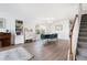 Elegant dining area with hardwood floors, modern lighting, and a large window with a view at 245 Weatherstone Pointe Dr, Woodstock, GA 30188