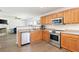 This kitchen features stainless steel appliances and plenty of countertop space at 245 Weatherstone Pointe Dr, Woodstock, GA 30188