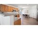 Bright eat-in kitchen with wood cabinets, stainless steel appliances, and granite countertops at 245 Weatherstone Pointe Dr, Woodstock, GA 30188