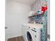 Well-equipped laundry room with modern washer and dryer at 245 Weatherstone Pointe Dr, Woodstock, GA 30188