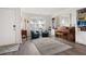 Cozy living room featuring stylish furniture, hardwood floors, and a bright, welcoming atmosphere at 245 Weatherstone Pointe Dr, Woodstock, GA 30188