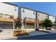 Rear view of modern townhomes with wooden balconies and attached garages at 3057 Windover Ln, Kennesaw, GA 30144