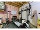 This unfinished basement offers unfinished walls, gym equipment and space at 3057 Windover Ln, Kennesaw, GA 30144