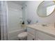 This bathroom features shower-tub combo, white cabinets and a marble look countertop at 3057 Windover Ln, Kennesaw, GA 30144