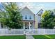 Charming two-story home features a classic white picket fence and lush green trees at 3057 Windover Ln, Kennesaw, GA 30144