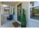 Welcoming front porch with a decorated green door and a cozy seating area at 3057 Windover Ln, Kennesaw, GA 30144