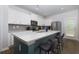 Well-appointed eat-in kitchen with stainless appliances and quartz counters at 3057 Windover Ln, Kennesaw, GA 30144