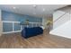 Comfortable living room with board and batten accent wall and adjacent staircase at 3057 Windover Ln, Kennesaw, GA 30144
