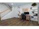 Well-lit home office with stairs, wood-look floors, built-in shelving, and a world map feature at 3057 Windover Ln, Kennesaw, GA 30144