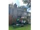 Backyard view of the rear exterior of the home with wood fence at 8564 Jamestown Way, Jonesboro, GA 30238