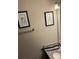 Powder room featuring granite counter and framed art on the beige walls at 8564 Jamestown Way, Jonesboro, GA 30238