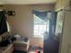 Bedroom needing remodel features neutral walls, curtains, and carpet at 8564 Jamestown Way, Jonesboro, GA 30238