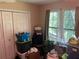 Bedroom featuring double windows, neutral walls and double door closet at 8564 Jamestown Way, Jonesboro, GA 30238