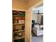Bedroom closet area with shelving and a view of another room with a couch at 8564 Jamestown Way, Jonesboro, GA 30238
