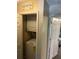 Laundry area with stacked washer and dryer in an alcove at 8564 Jamestown Way, Jonesboro, GA 30238
