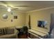 Cozy living room featuring neutral walls, wood floors, and ceiling fan at 8564 Jamestown Way, Jonesboro, GA 30238