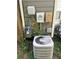 Image shows the home's utility connections, including the air conditioning unit and gas and electric meters at 8564 Jamestown Way, Jonesboro, GA 30238