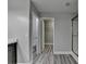 Bathroom with gray walls, vinyl plank flooring, stand up shower and view of toilet and closet at 969 Bob Hannah Cir, Lawrenceville, GA 30044
