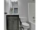 Bathroom featuring a modern vanity, mirror, and a white toilet at 969 Bob Hannah Cir, Lawrenceville, GA 30044