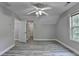 Bedroom featuring vaulted ceilings, modern ceiling fan, and wood-look flooring at 969 Bob Hannah Cir, Lawrenceville, GA 30044