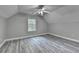 Spacious bedroom featuring vaulted ceilings, modern ceiling fan, and wood-look flooring at 969 Bob Hannah Cir, Lawrenceville, GA 30044