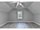 Spacious bedroom featuring vaulted ceilings, modern ceiling fan, and wood-look flooring at 969 Bob Hannah Cir, Lawrenceville, GA 30044