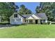 Charming one-story home boasts a two-car garage and a well-manicured front lawn at 969 Bob Hannah Cir, Lawrenceville, GA 30044