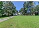 This home is on a spacious lot with mature trees and a well-manicured front lawn at 969 Bob Hannah Cir, Lawrenceville, GA 30044