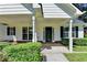 The home has a inviting covered front porch with classic columns and landscaping at 969 Bob Hannah Cir, Lawrenceville, GA 30044