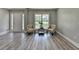 Bright, spacious living room features elegant flooring and neutral paint at 969 Bob Hannah Cir, Lawrenceville, GA 30044