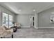 Bright, spacious living room features elegant flooring and neutral paint at 969 Bob Hannah Cir, Lawrenceville, GA 30044