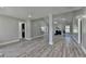 Bright, spacious living room features elegant flooring, neutral paint, and an open layout at 969 Bob Hannah Cir, Lawrenceville, GA 30044