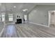 Bright, spacious living room features elegant flooring, neutral paint, and fireplace at 969 Bob Hannah Cir, Lawrenceville, GA 30044