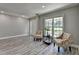 Bright, spacious living room features elegant flooring and neutral paint at 969 Bob Hannah Cir, Lawrenceville, GA 30044