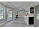 Bright living room with a fireplace, open to the kitchen and lots of natural light from the backyard at 969 Bob Hannah Cir, Lawrenceville, GA 30044