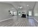 Bright, spacious living room features elegant flooring, neutral paint, and fireplace at 969 Bob Hannah Cir, Lawrenceville, GA 30044
